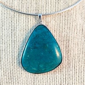 Turquoise pendant wrapped in sterling
